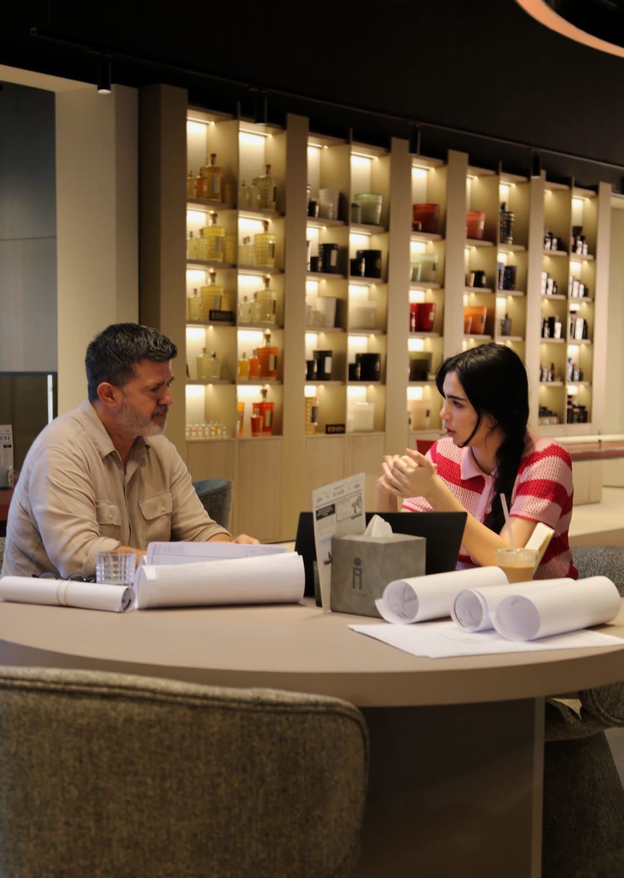 A designer and client reviewing plans together at the Coffee Bar